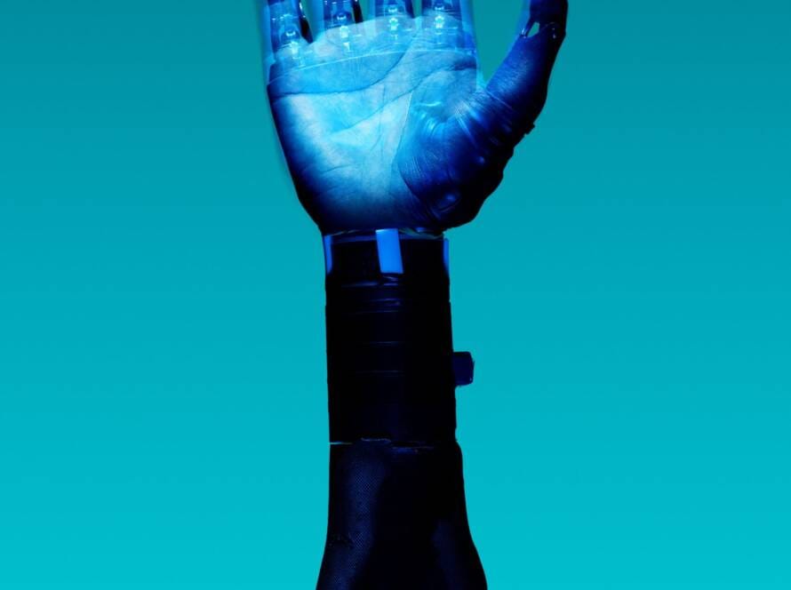 alt="Free Prosthetic Arm on Blue Background Stock Photo"
