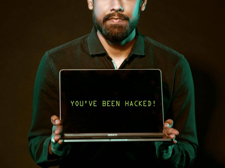 Free Man Holding Laptop Computer With Both Hands Stock Photo