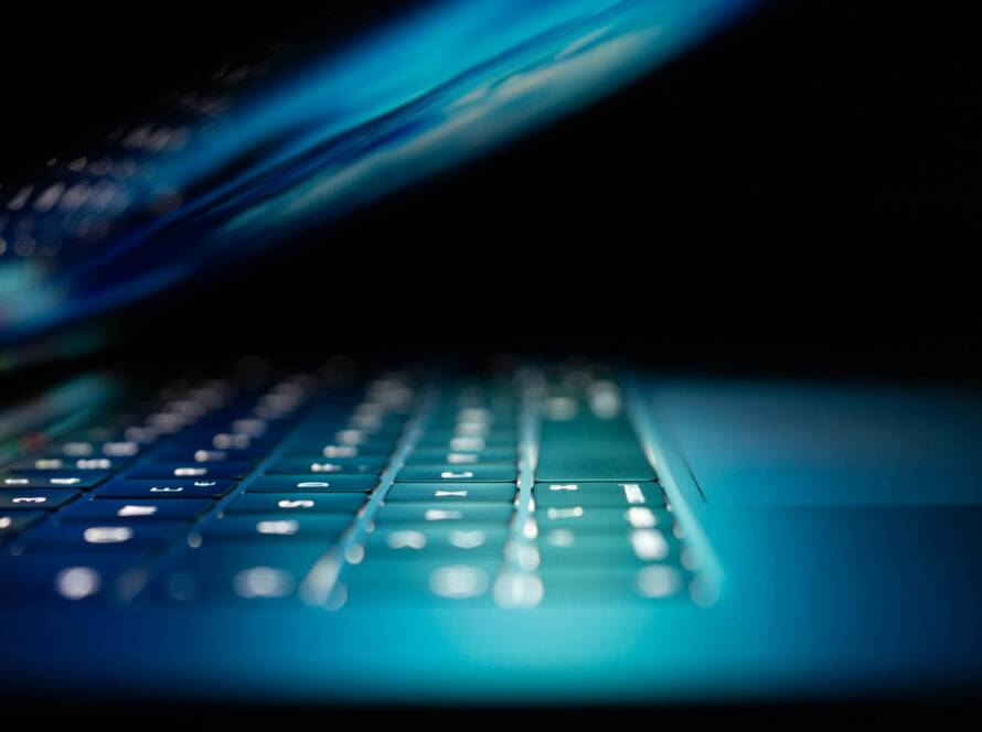 closeup photo of turned-on blue and white laptop computer