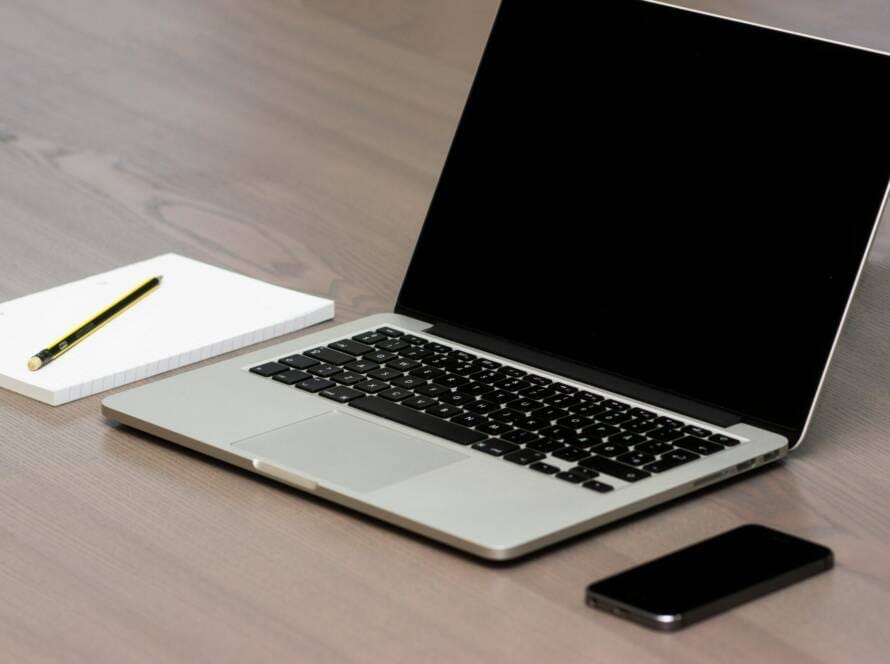 Free Silver Macbook Beside Iphone Stock Photo