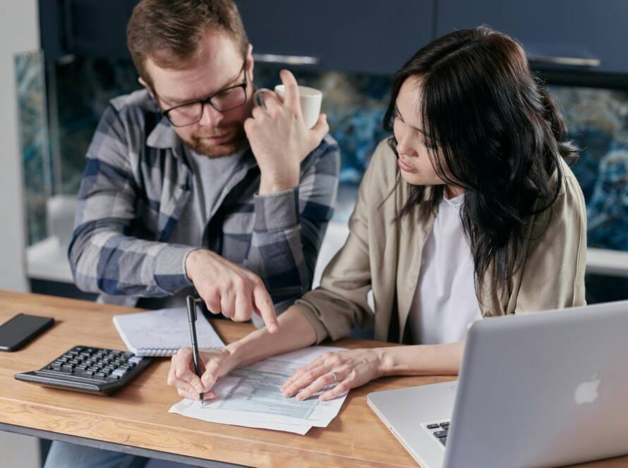 Free couple calculating al their bills stock photo
